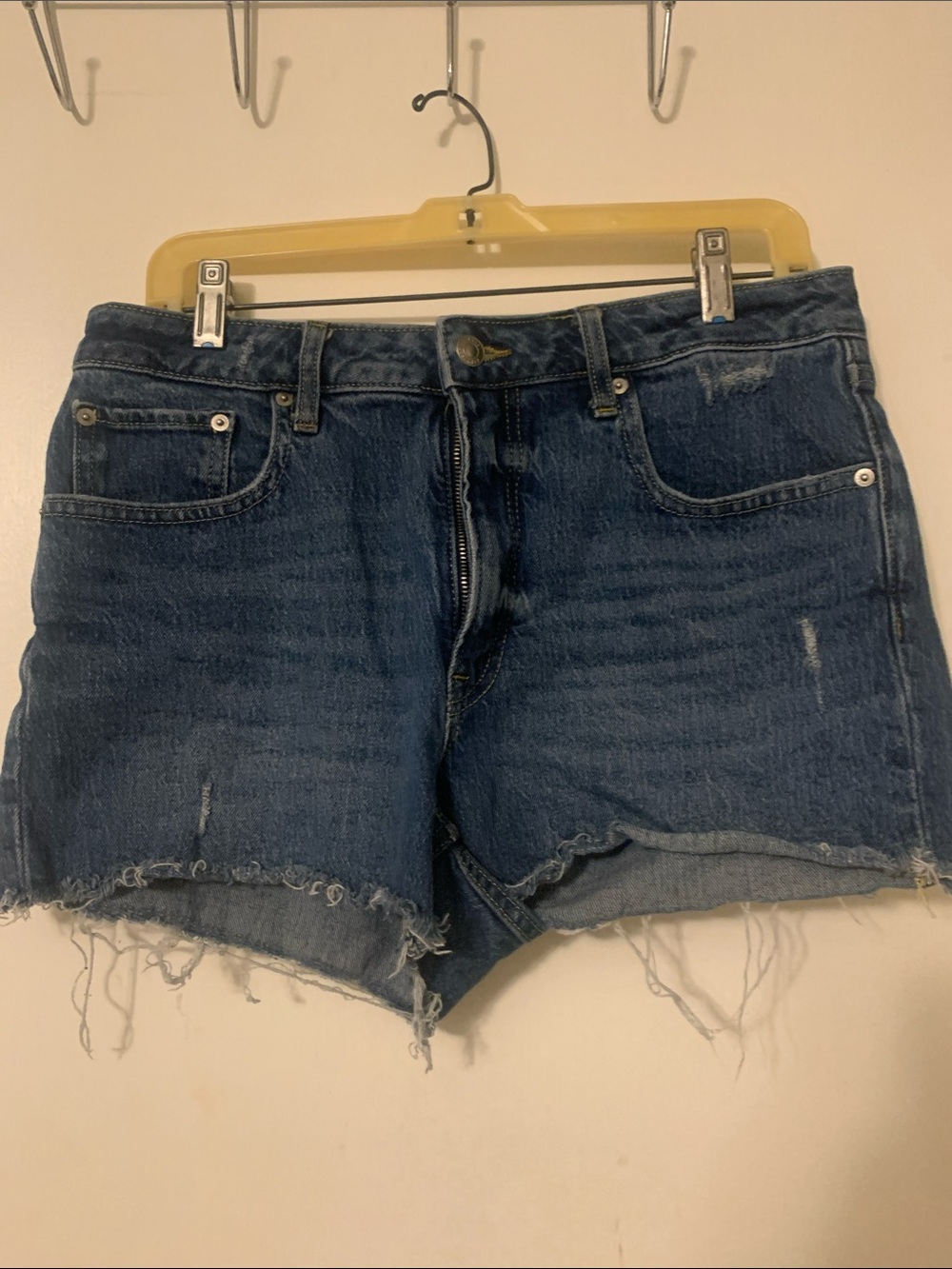Mid-Rise Dark Blue Denim Cutoff Shorts with Frayed Hem